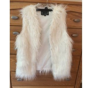 White fur vest